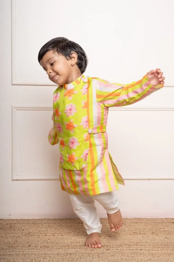 Bright lime green floral printed kurta with off-white pants, a fun and vibrant choice for your little one’s festive wardrobe