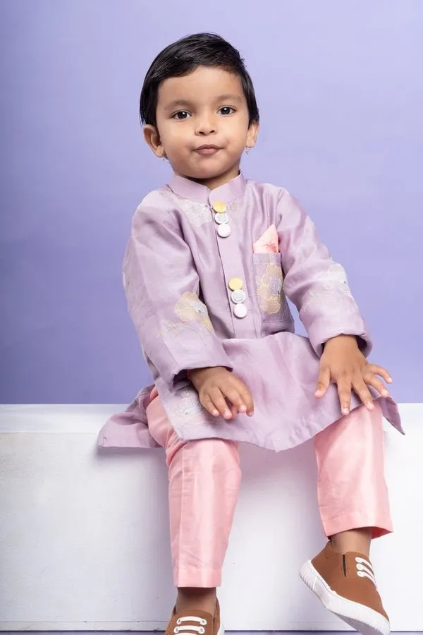 Charming lavender kurta with delicate floral embroidery paired with Peach pants, perfect for festive occasions