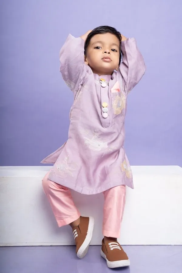 Charming lavender kurta with delicate floral embroidery paired with Peach pants, perfect for festive occasions