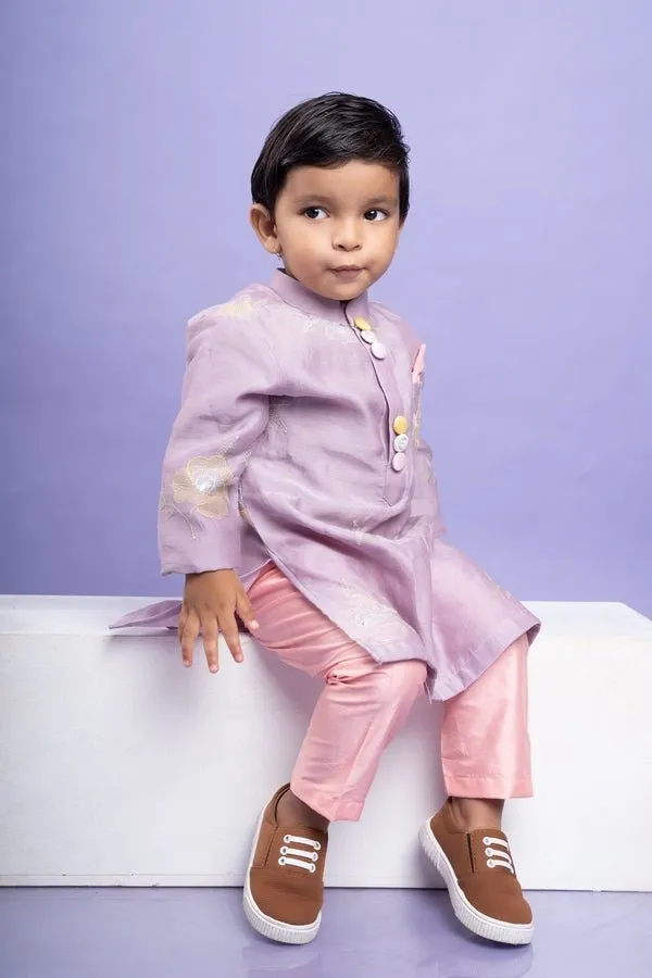 Charming lavender kurta with delicate floral embroidery paired with Peach pants, perfect for festive occasions