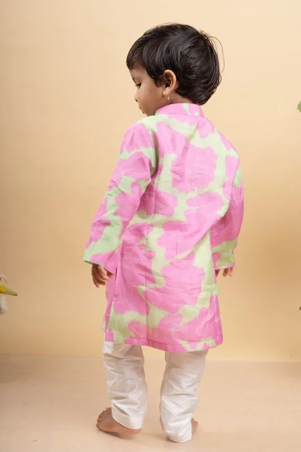 Vibrant pink and green tie-dye kurta paired with classic white pants for a playful yet elegant festive look